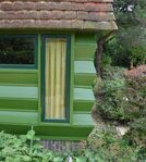De harmonicawand van het huis, gemaakt van houten planken.
<br/>
Richard Keijzer, 2014-07-24